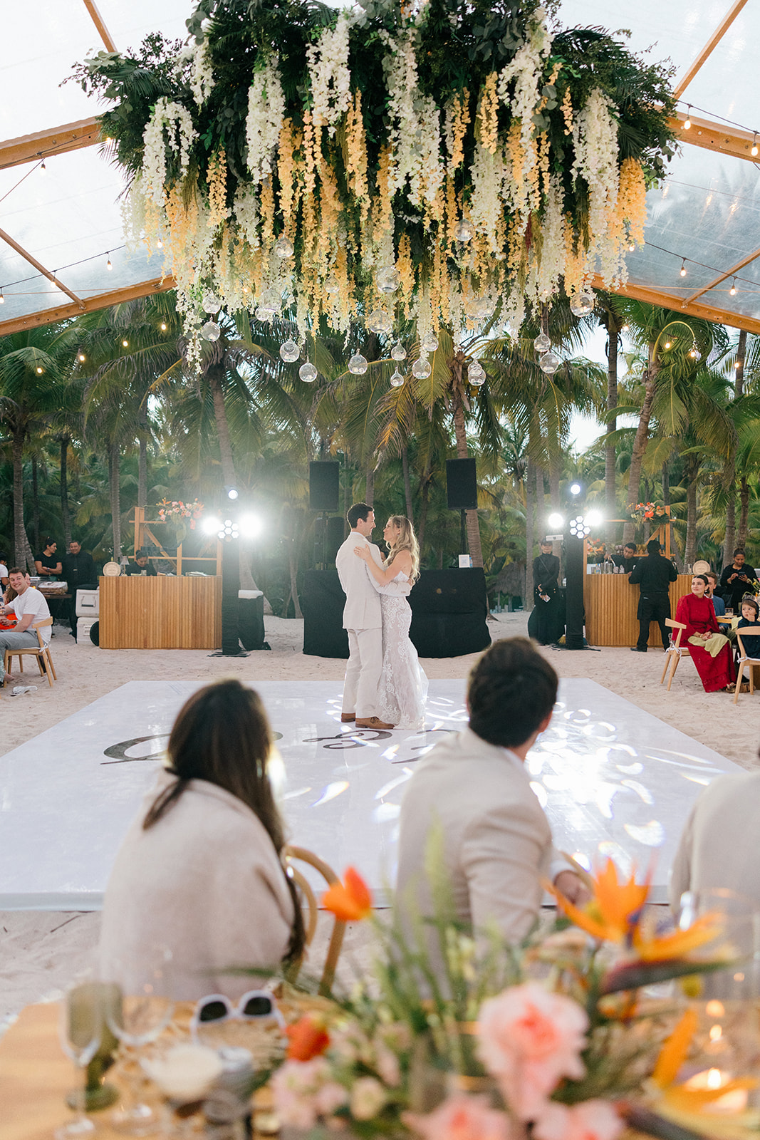 Wedding reception dancing under floral ceiling, Riviera Maya wedding photographer