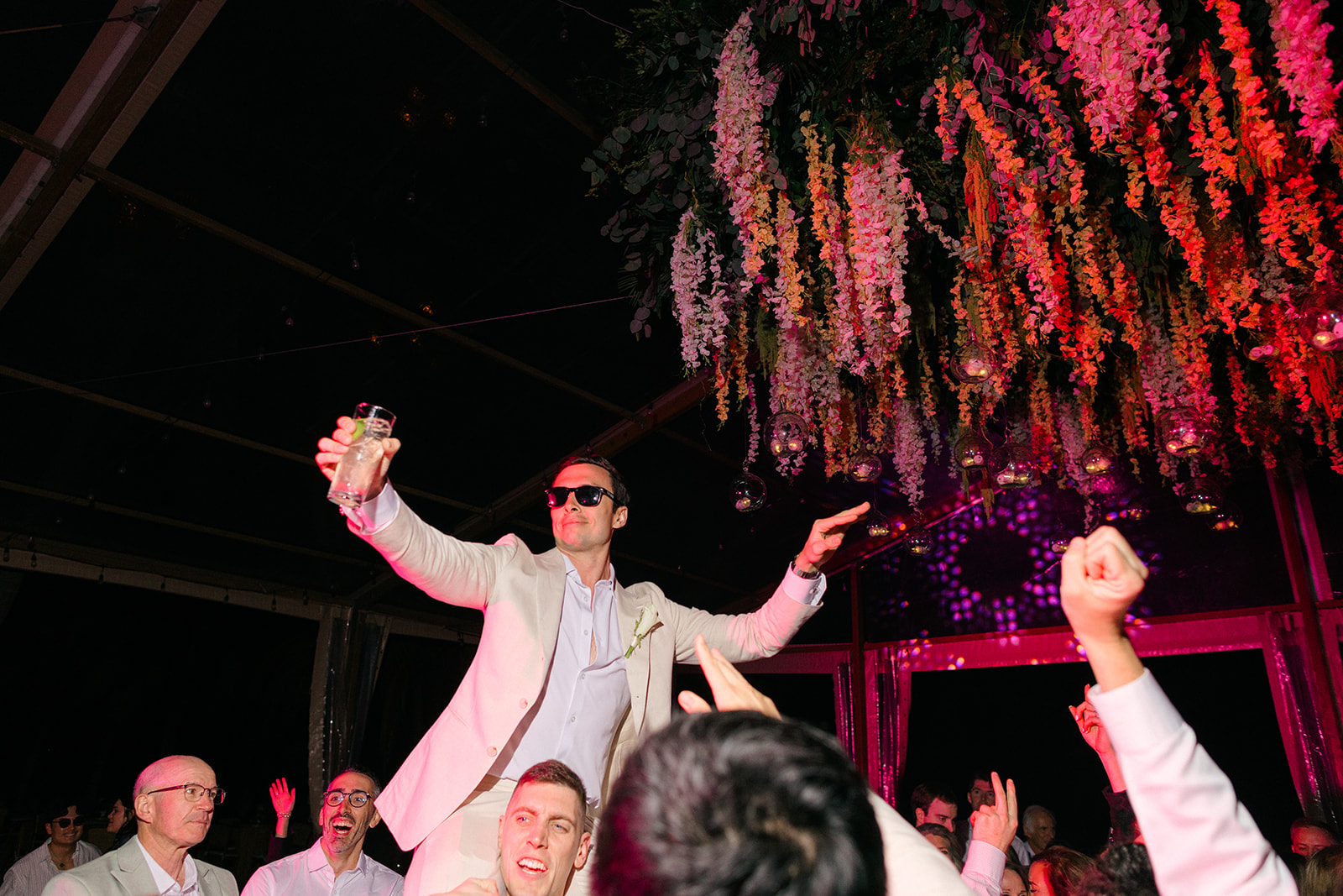 Groom dancing with guests at reception, Riviera Maya wedding photographer
