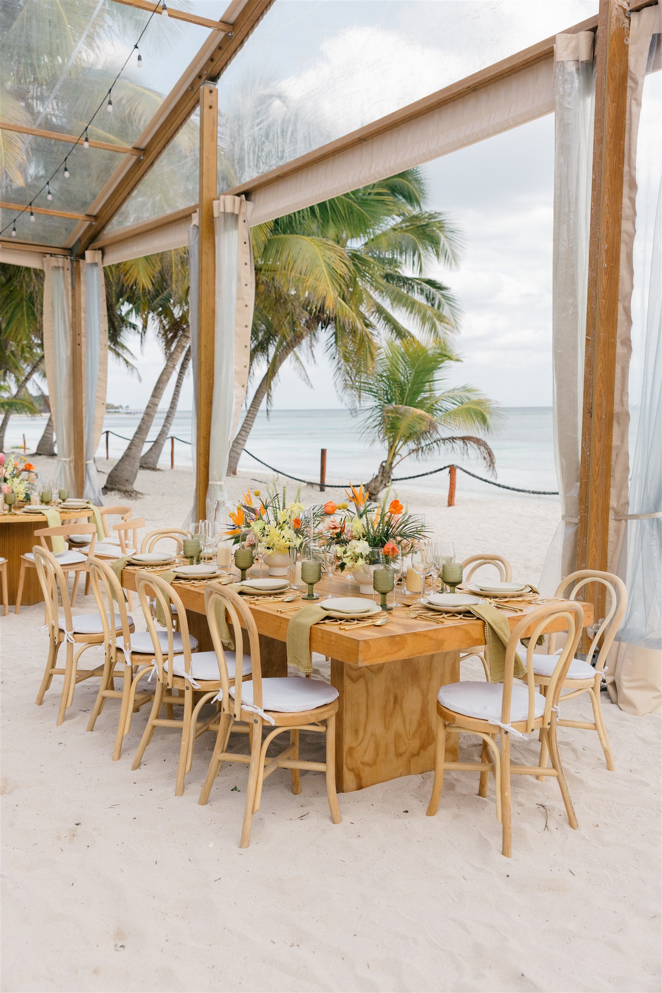 Outdoor reception tables under palm trees, Riviera Maya wedding
