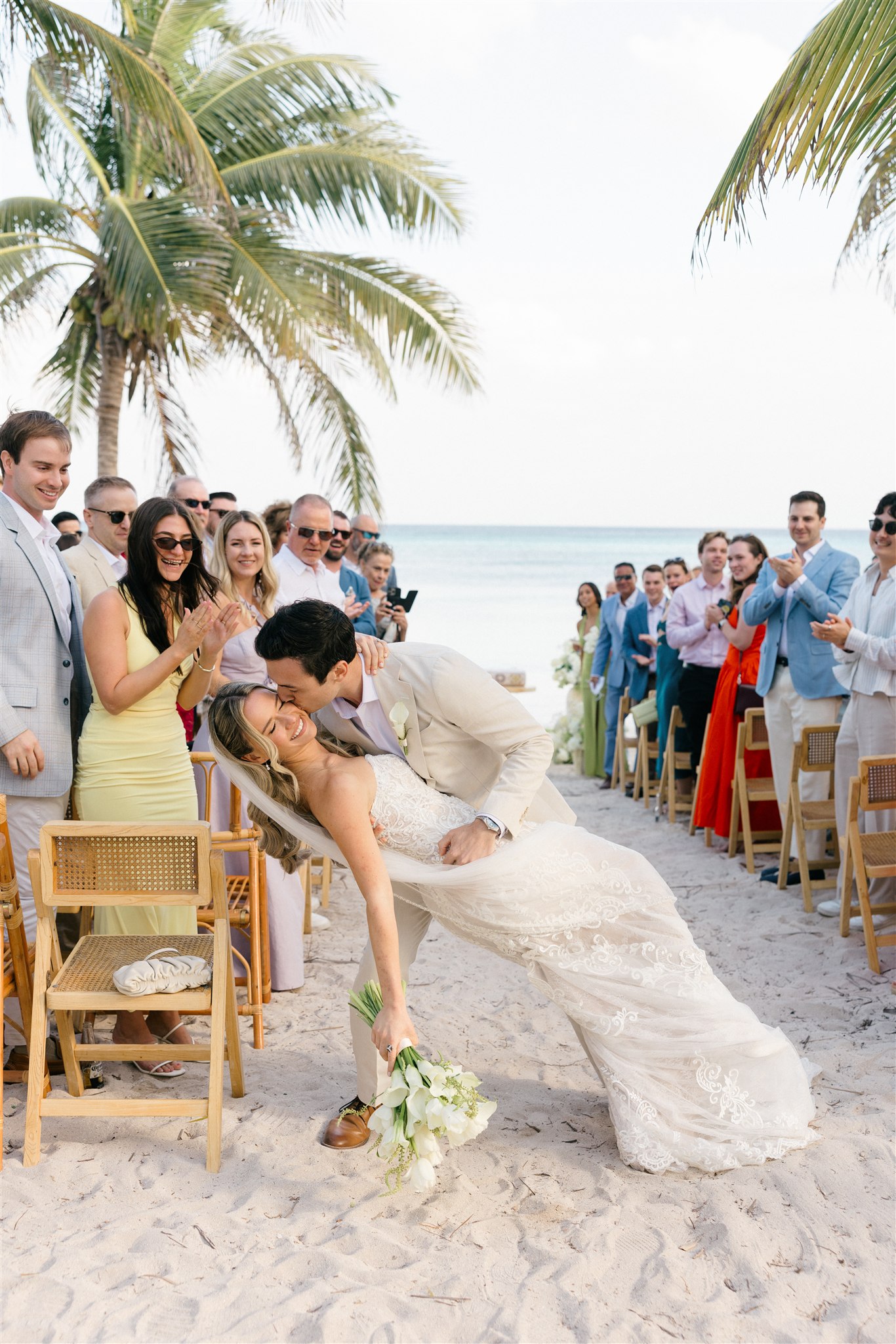 Wedding party celebrating on the beach, Riviera Maya wedding photographer