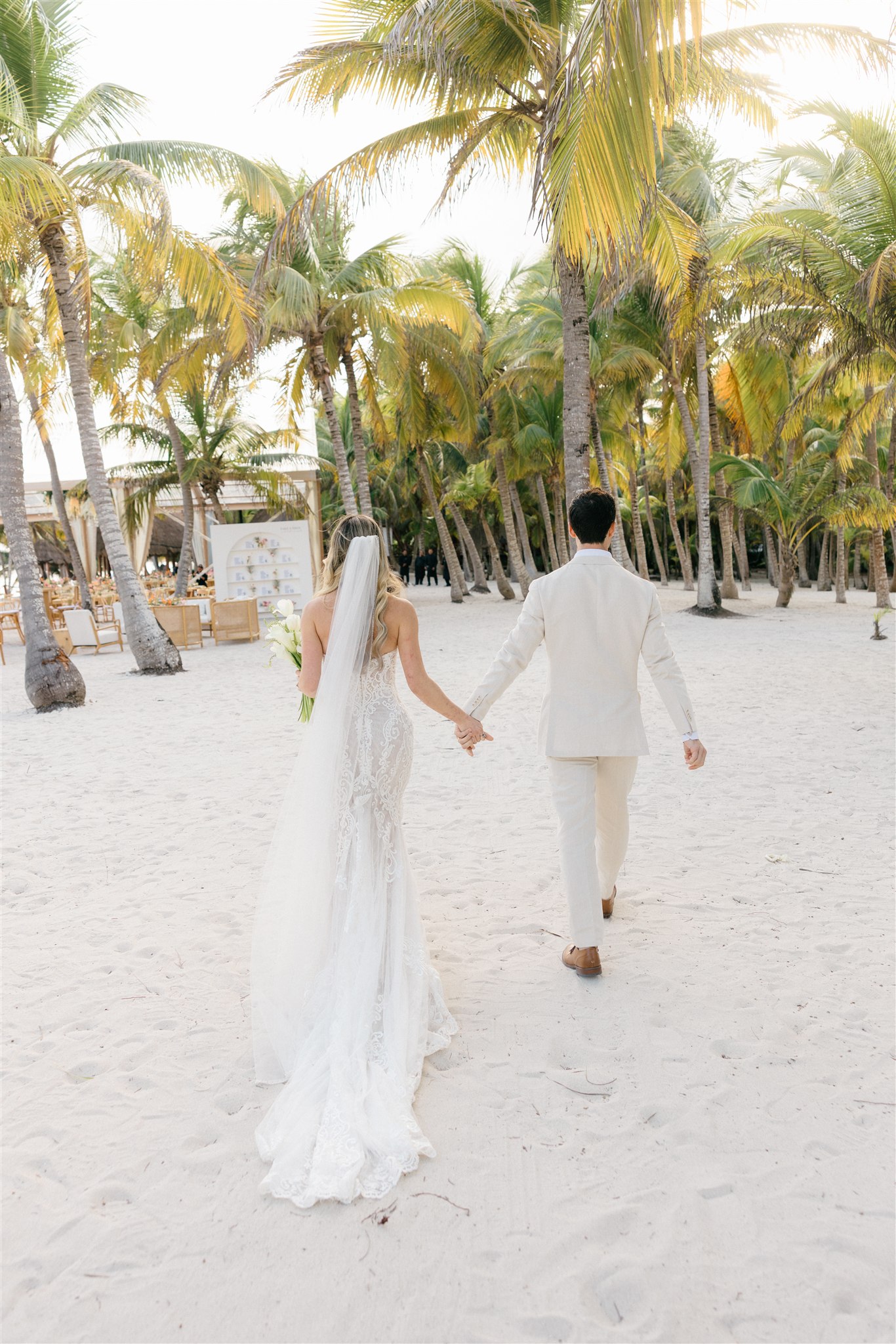 Couple walking away after ceremony, Riviera Maya destination wedding