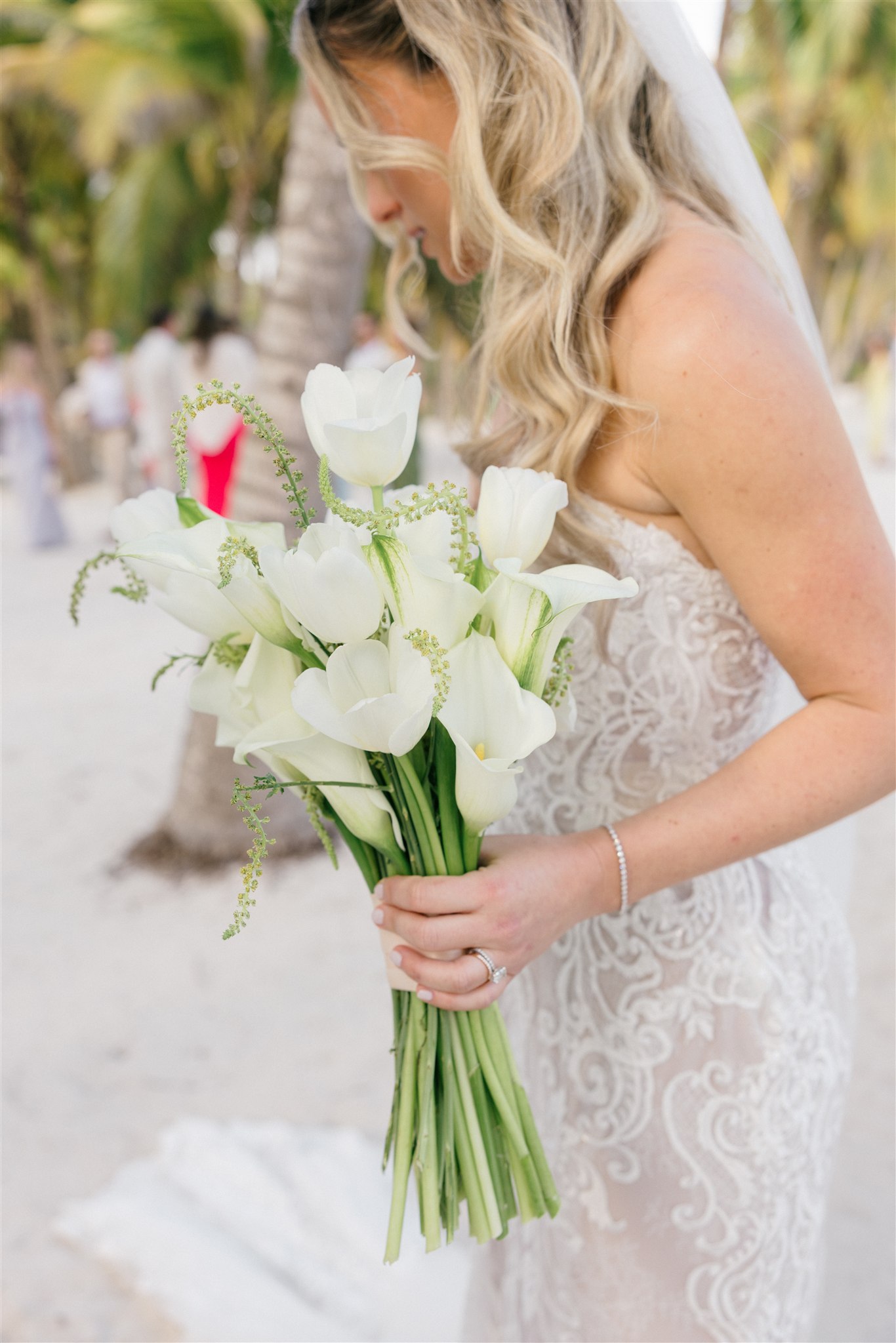 Bride holding white calla lily bouquet, Riviera Maya wedding