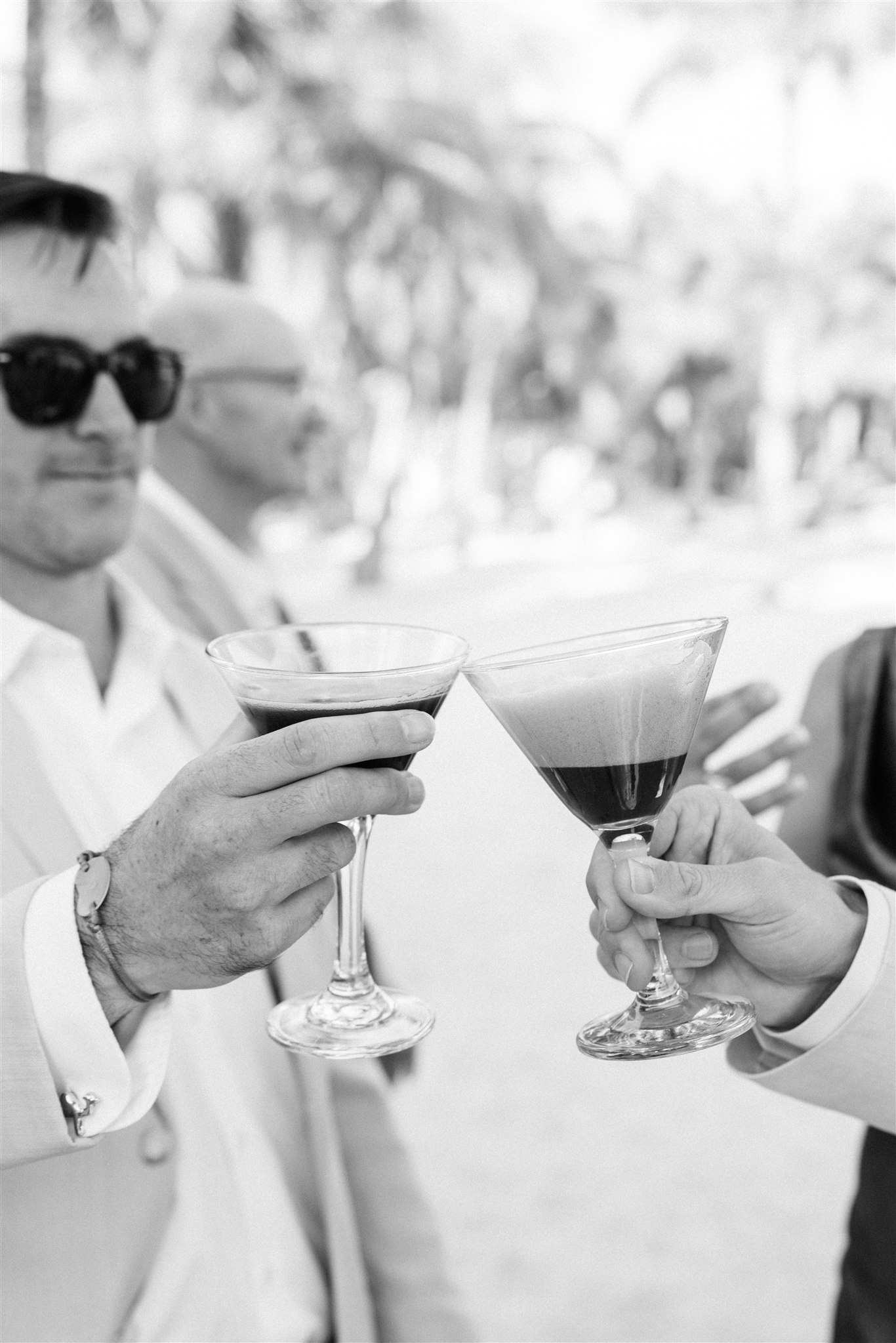 Guests toasting in black and white, Riviera Maya wedding photographer