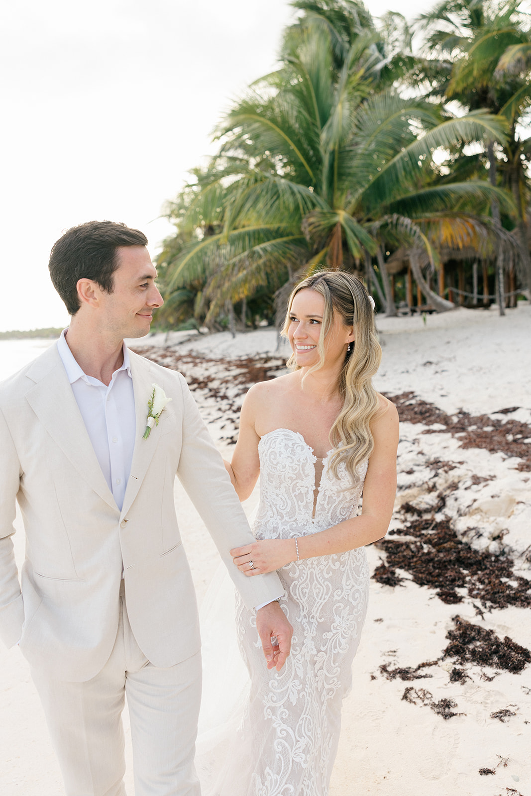 Couple laughing during beach portraits, Riviera Maya wedding photographer