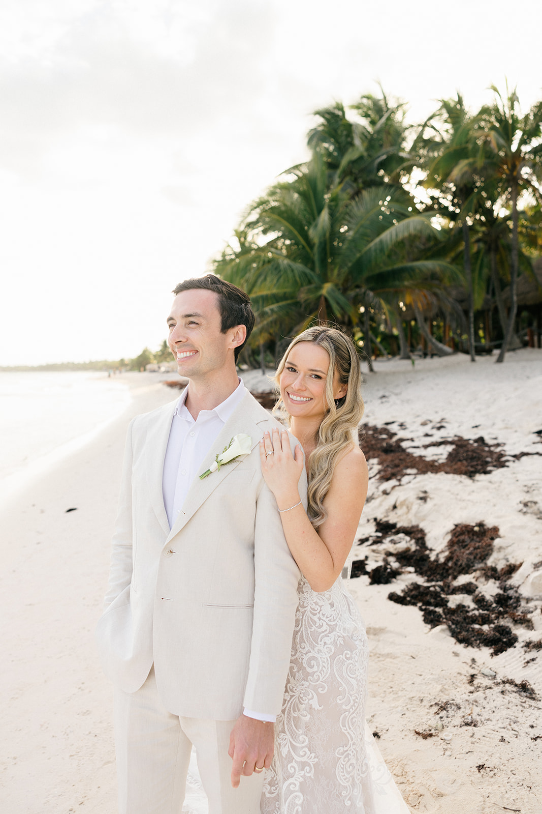 Couple laughing on the beach at golden hour, Riviera Maya wedding photographer