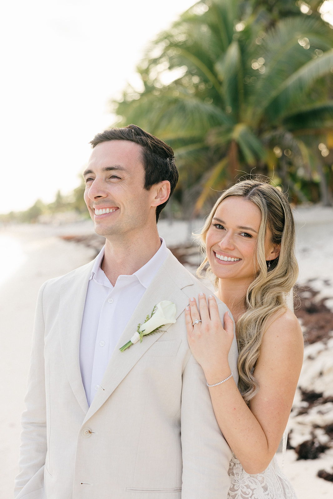 Couple laughing during beach portraits, Riviera Maya wedding photographer