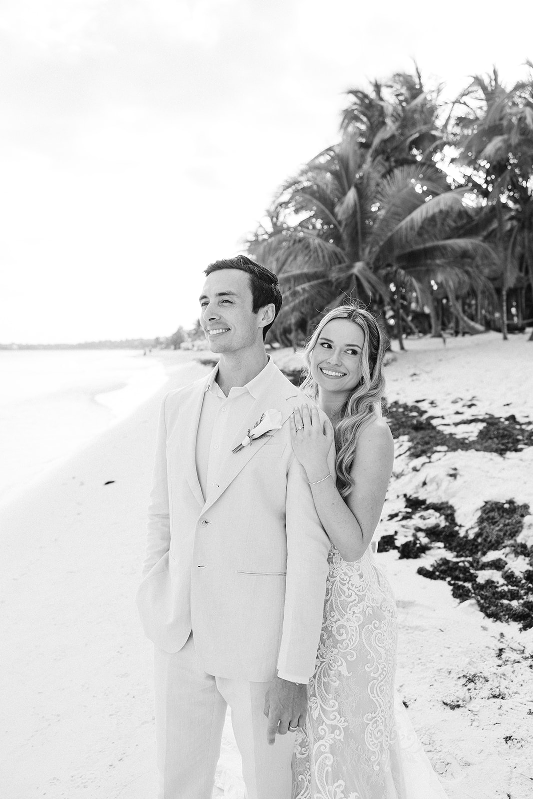 Groom in black and white portrait on the shoreline, Saasil Kantenah