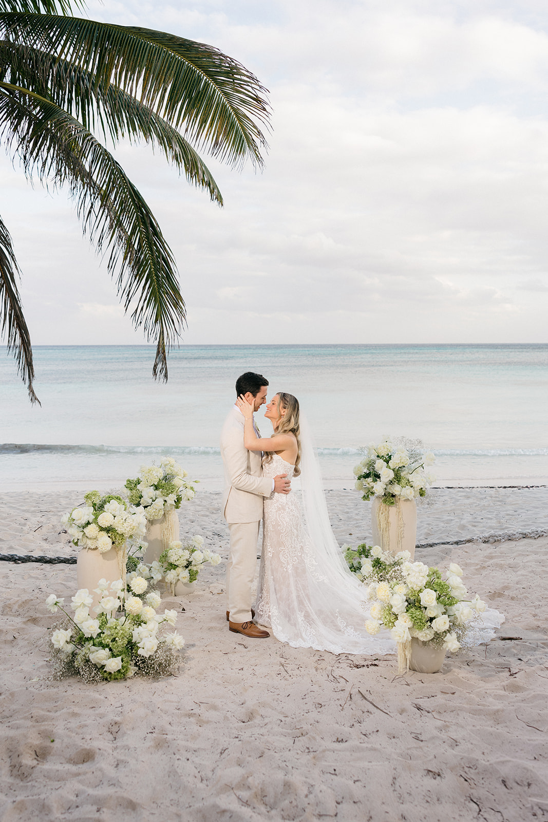 Wedding entrance arch with palm trees, Riviera Maya destination wedding